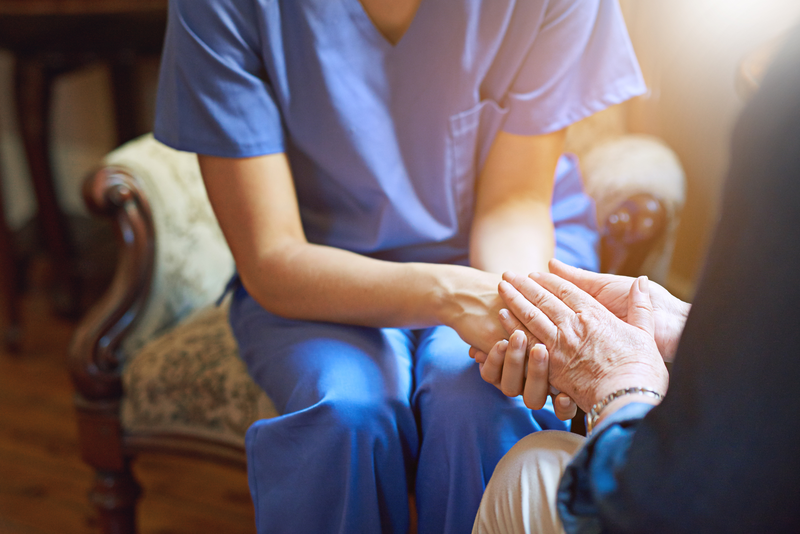 nurse holding hands