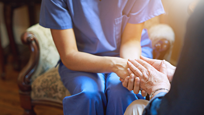 nurse holding hands